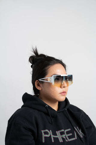 woman wearing womens oversize shield sunglasses