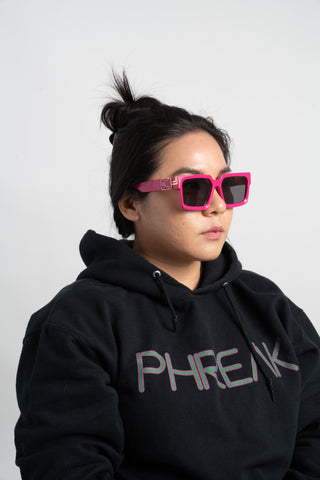 woman wearing black hoodie and pink square sunglasses