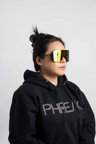 woman wearing black hoodie and mirrored shield sunglasses