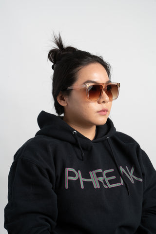 woman wearing black phreak hoodie and square sunglasses