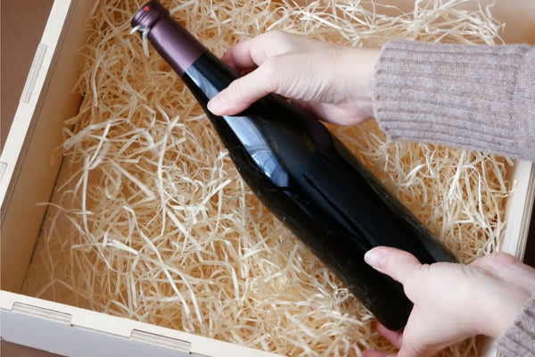 Wine bottle inside a delivery box