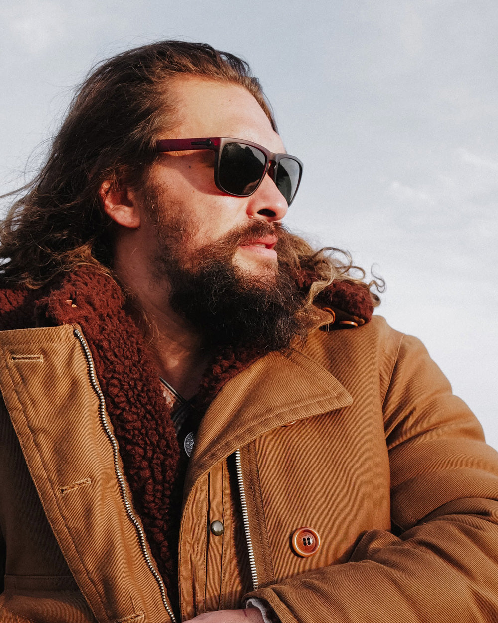 So iLL x On The Roam x Electric sunglasses by jason momoa shown being worn by jason momoa on a motorcycle