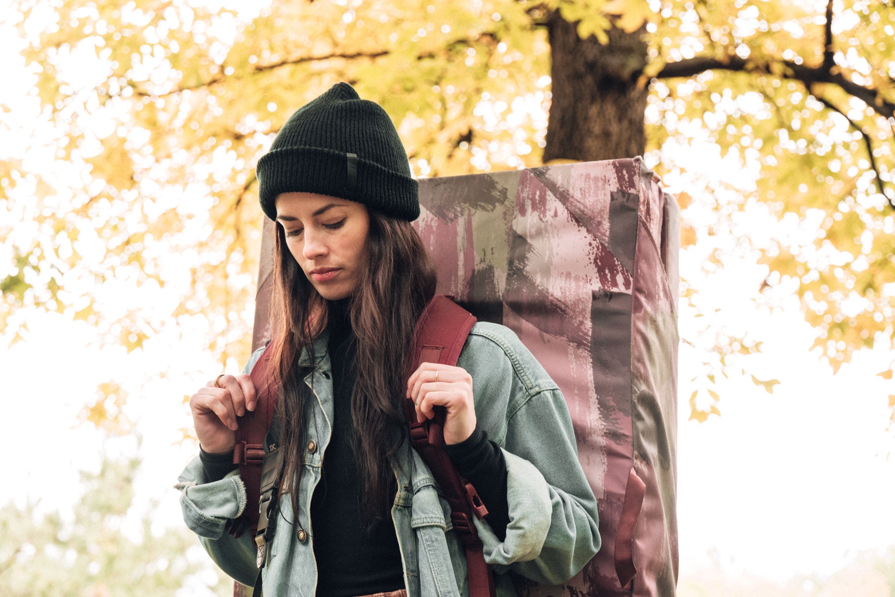 so ill x on the roam beanie being worn by a woman with a crash pad on