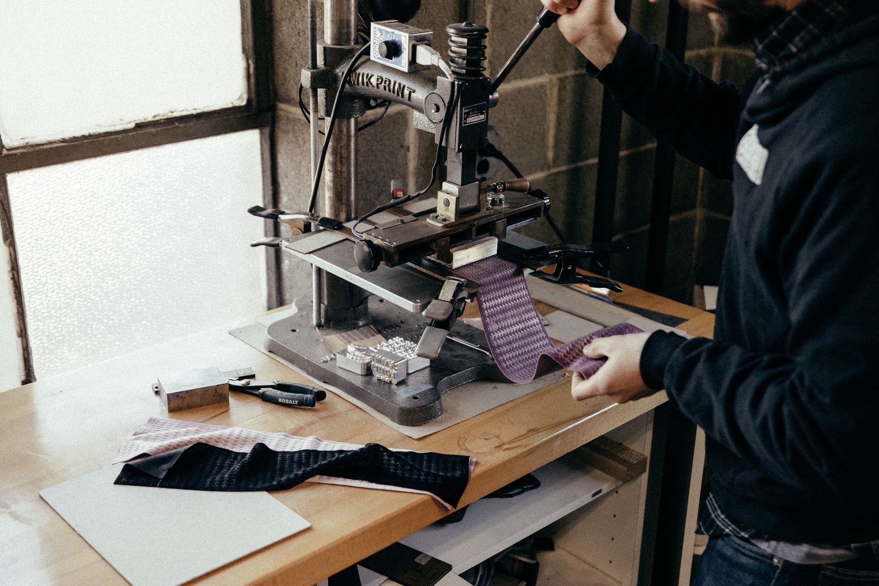 so ill x on the roam scrunchie being produced at the wellmade workshop