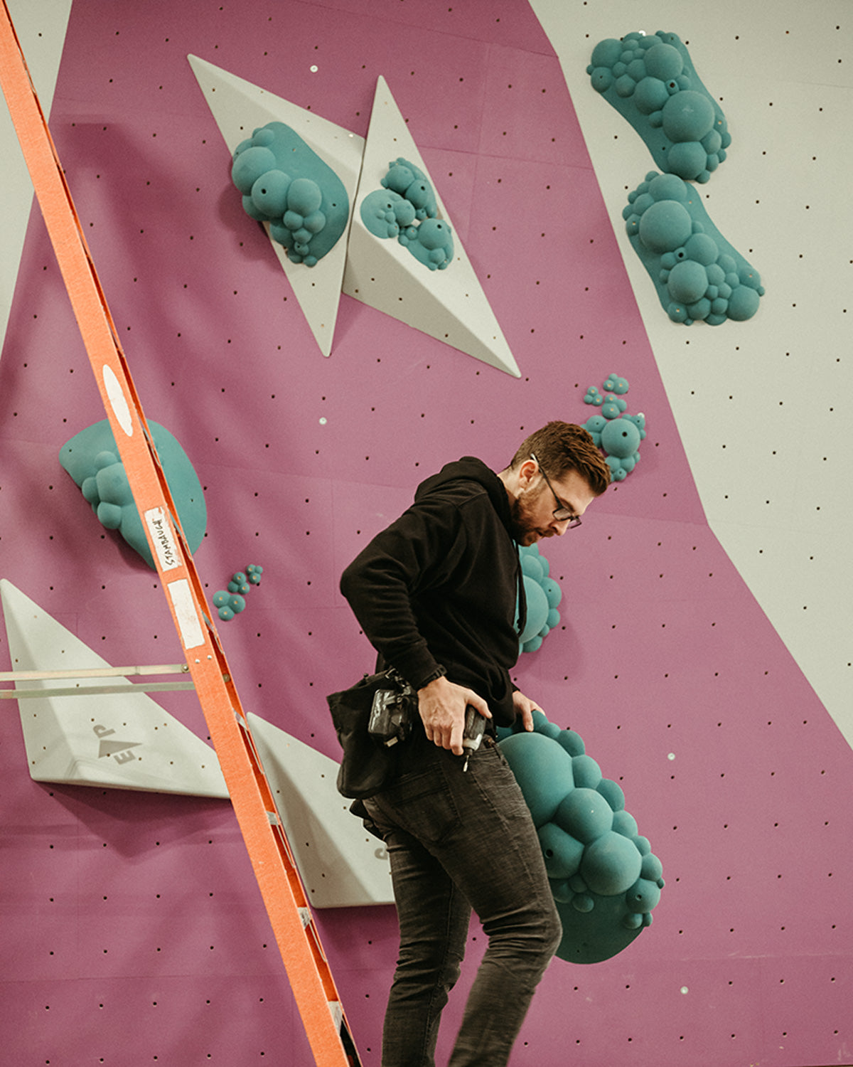 miles west puts up a climbing route with the so ill roids