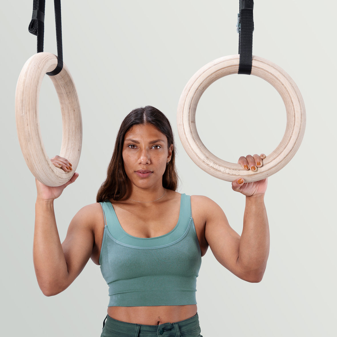 Meagan Martin hangs from her signature mega so ill wooden rings