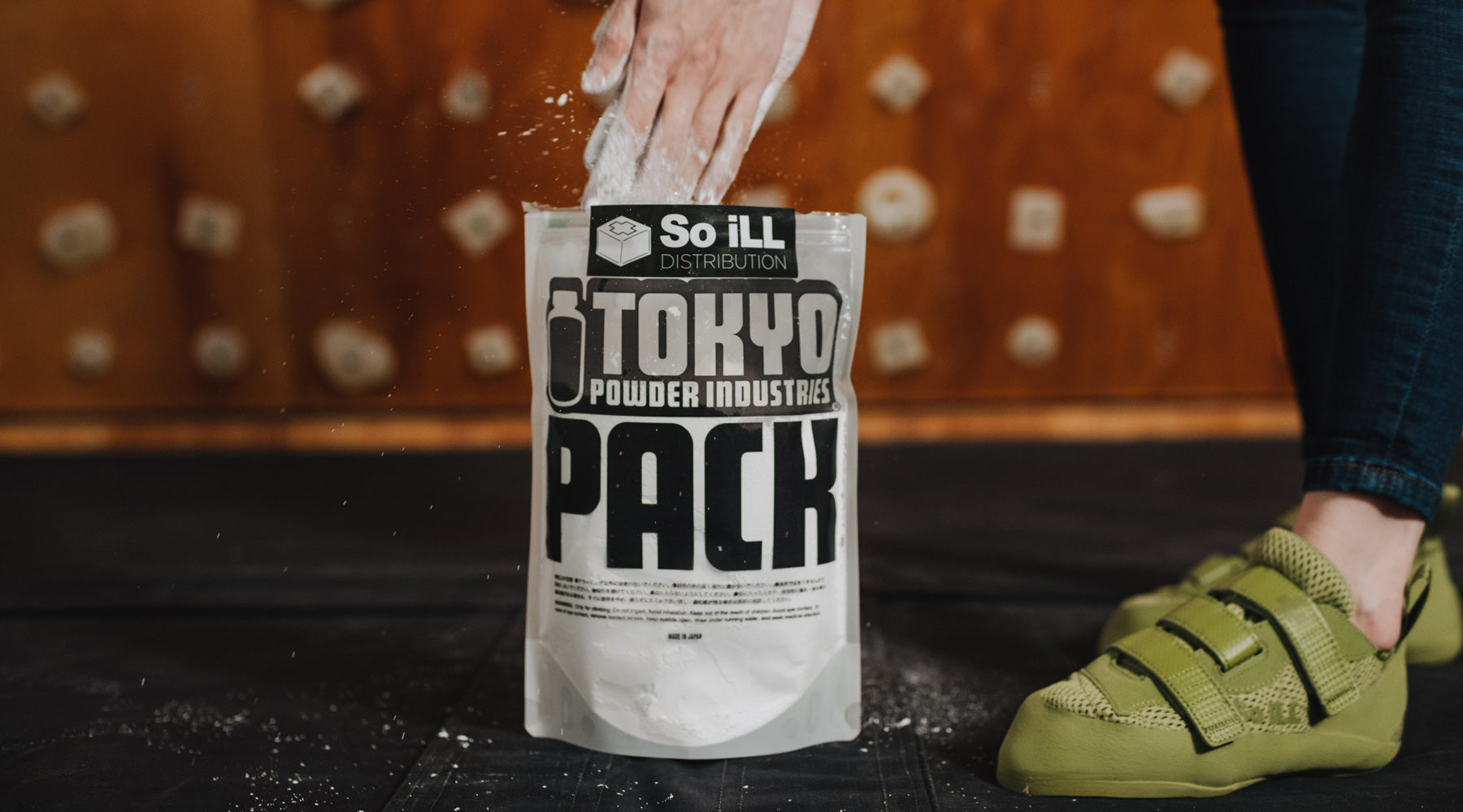 hands going into a bag of So iLL Tokyo Powder pure