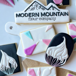 Royal icing cookies with Modern Mountain branding