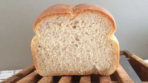 A cross-section view of a sandwich bread loaf made with potato flour