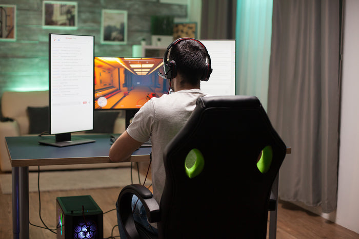 man sitting on gaming chair