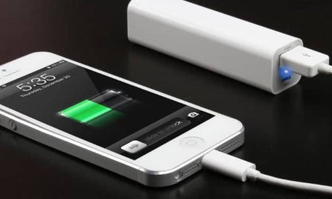 iPhone being charged by a power bank