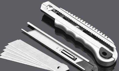 A utility blade, casing and the blade taken apart