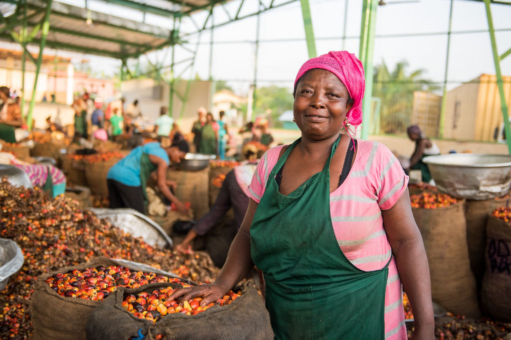 A smiling worker in production.