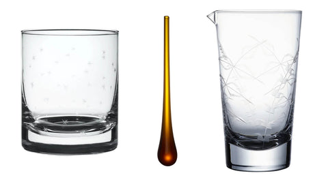 A pair of whisky glasses with stars design, £32. An amber muddler, £7.50. A mixing glass with fern design, £30.