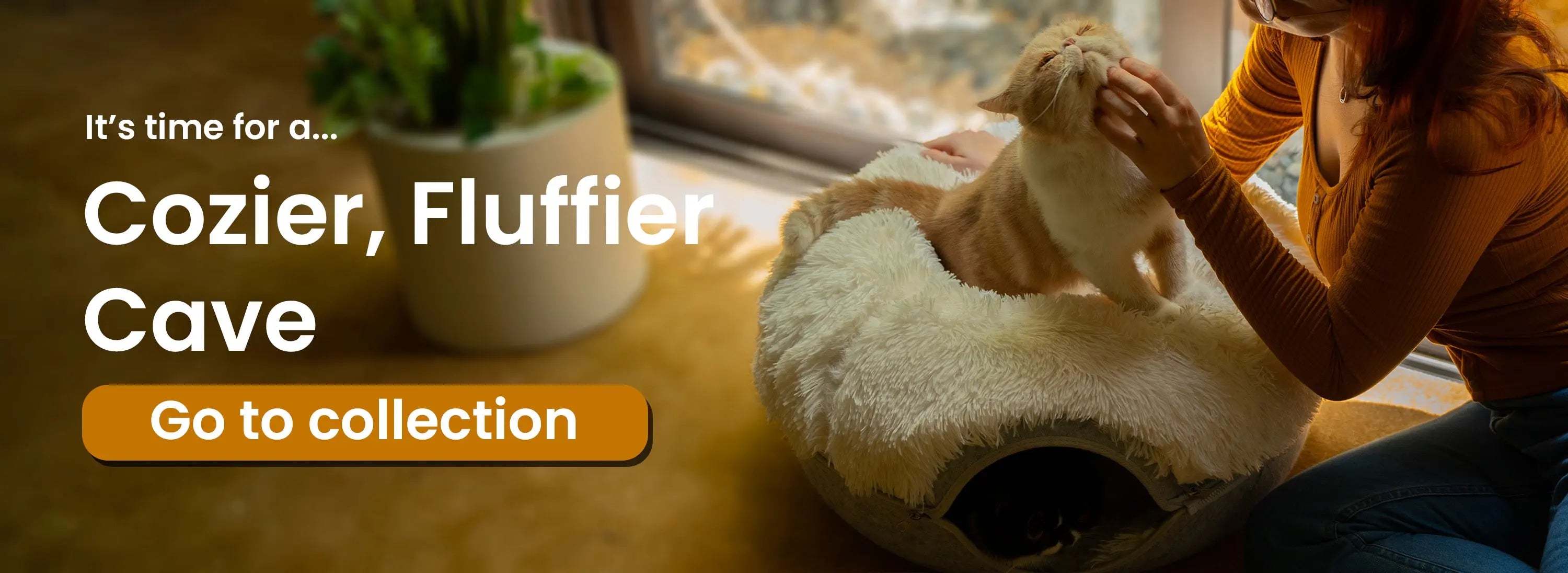Person petting a cat on a fluffy pet bed with text 'Cozier, Fluffier Cave. Go to collection.'