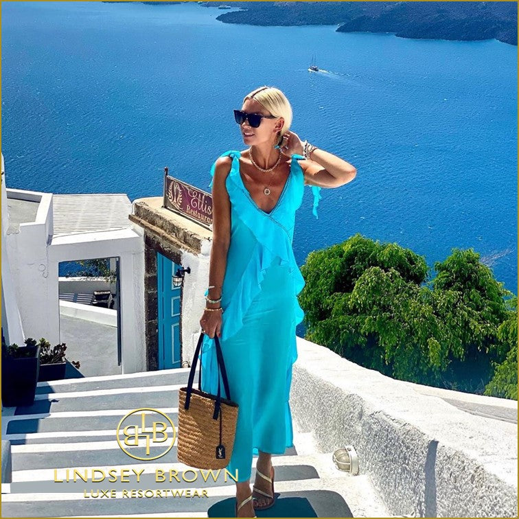 Anna Mavridis wears Lindsey Brown Turquoise Silk Ruffled Maxi Dress in Santorini 