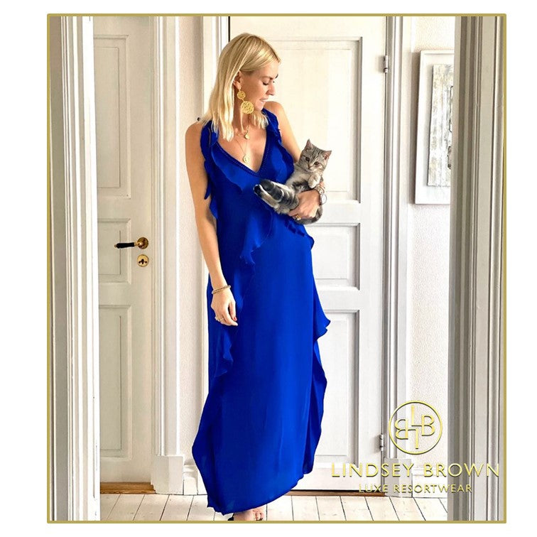 Anna Mavridis wears blue silk maxi dress by Lindsey Brown resort wear