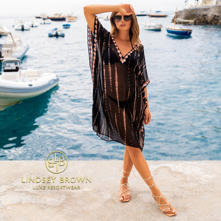 Black silk floaty designer kaftans to wear on holiday by Lindsey Brown resort wear 