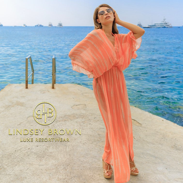 Orange silk designer maxi kaftans to wear on holiday by Lindsey Brown resort wear