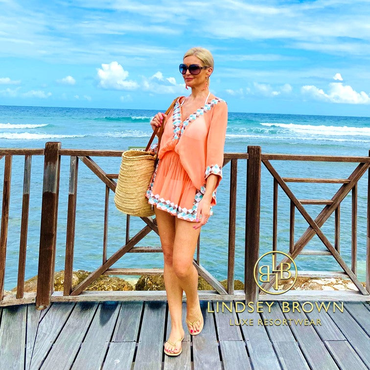 Orange silk designer resort wear to wear on holiday by Lindsey Brown resort wear 
