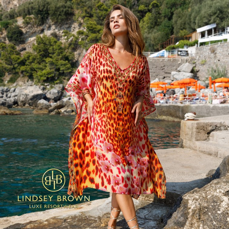 Red silk designer resort wear kaftans to wear to a resort closing party by Lindsey Brown.