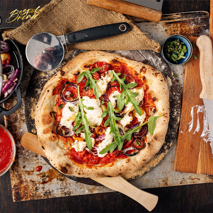 Red Onion And Tomato Pizza With Burrata Served With Fresh Arugula Leaves