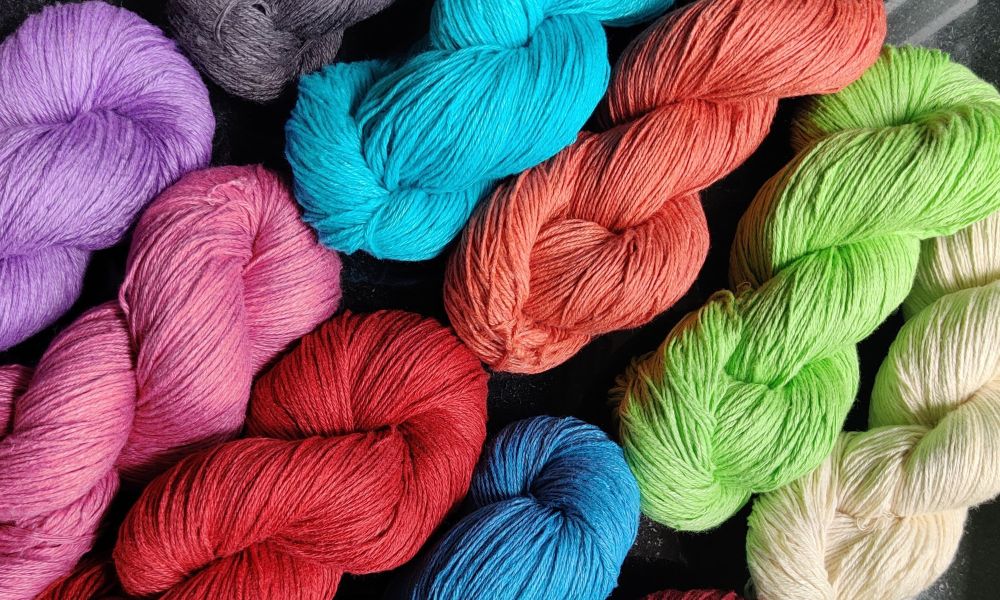 A jumbled collection of yarns in various hues, ready to inspire your next crafting adventure.