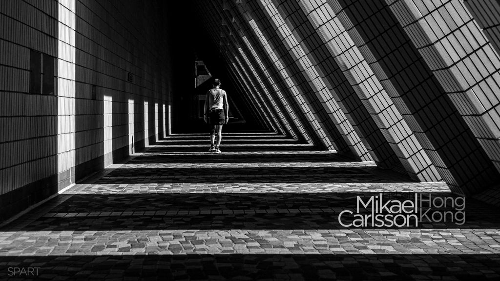 Early morning light casts shadows in a passageway at Hong Kong Cultural Centre in Tsim Sha Tsui. Hong Kong 2021  - Mikael Carlsson