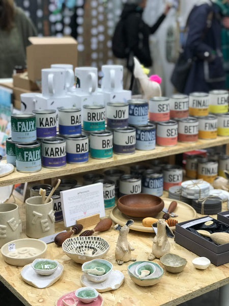 Homewares and ceramics displayed in the Bristol Pop-Up Shop, including Scents of Humour Candles, Moon Fire Clay sculptures and Willow Bloo ceramics