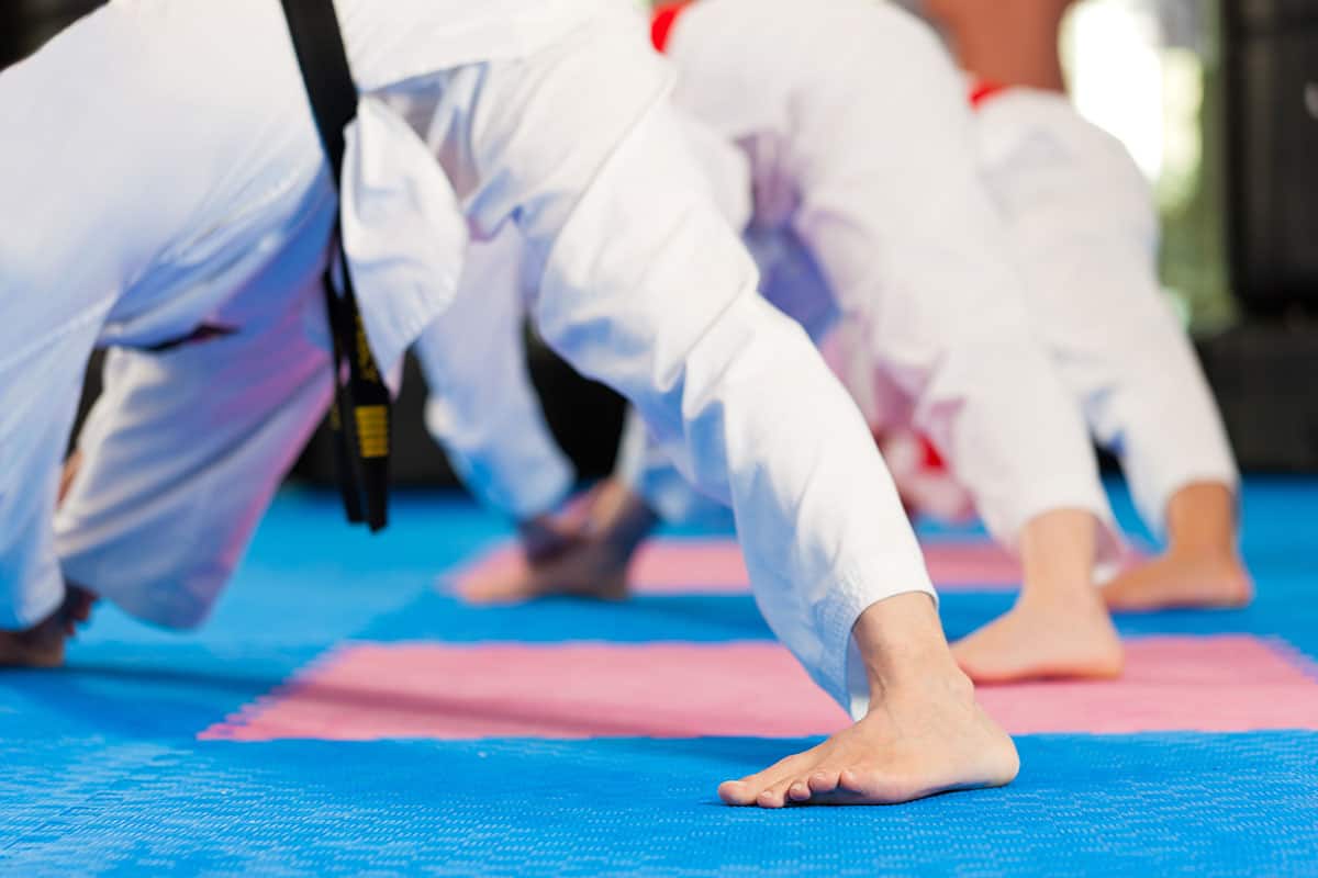 martial artists stretching before taekwondo