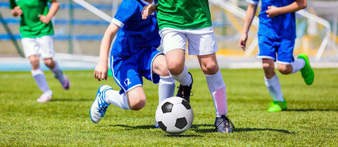 Soccer players playing a match with the best soccer shinguards.
