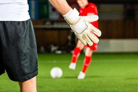 Best equipment for soccer training - a goalkeeper defending the goal.