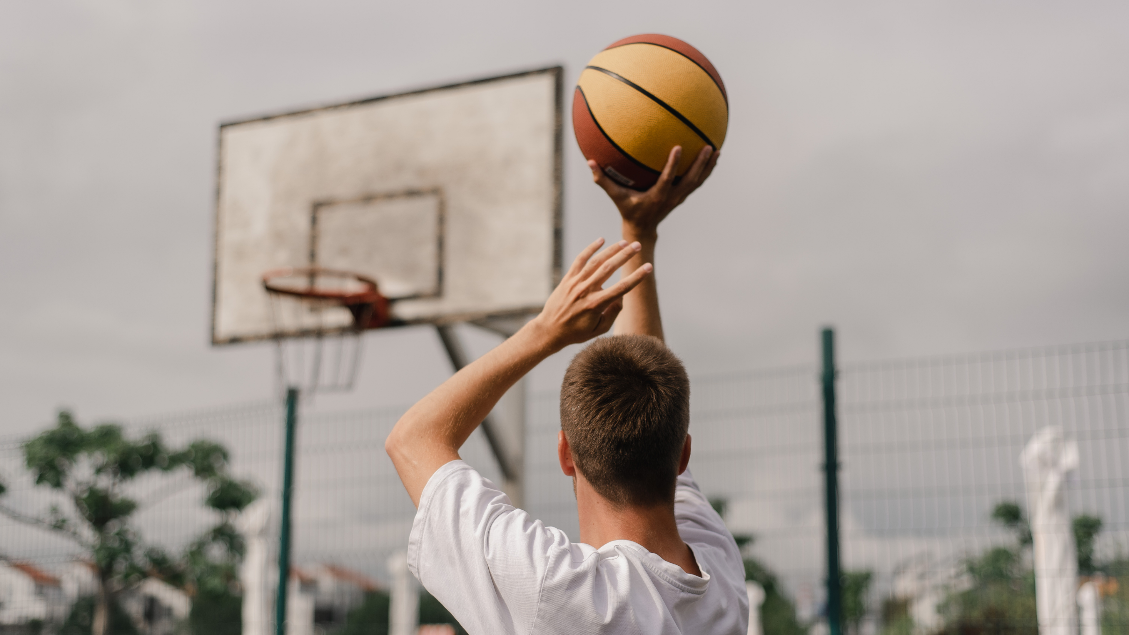 A person shooting a basket