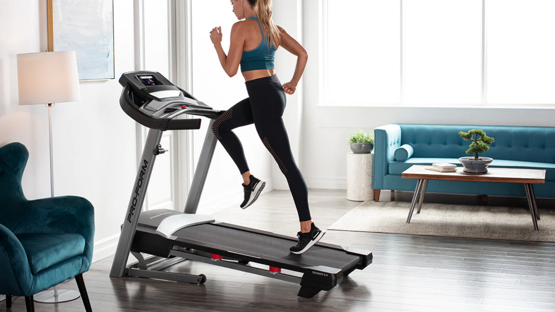 Woman running on a Proform trainer 9.0 treadmill,