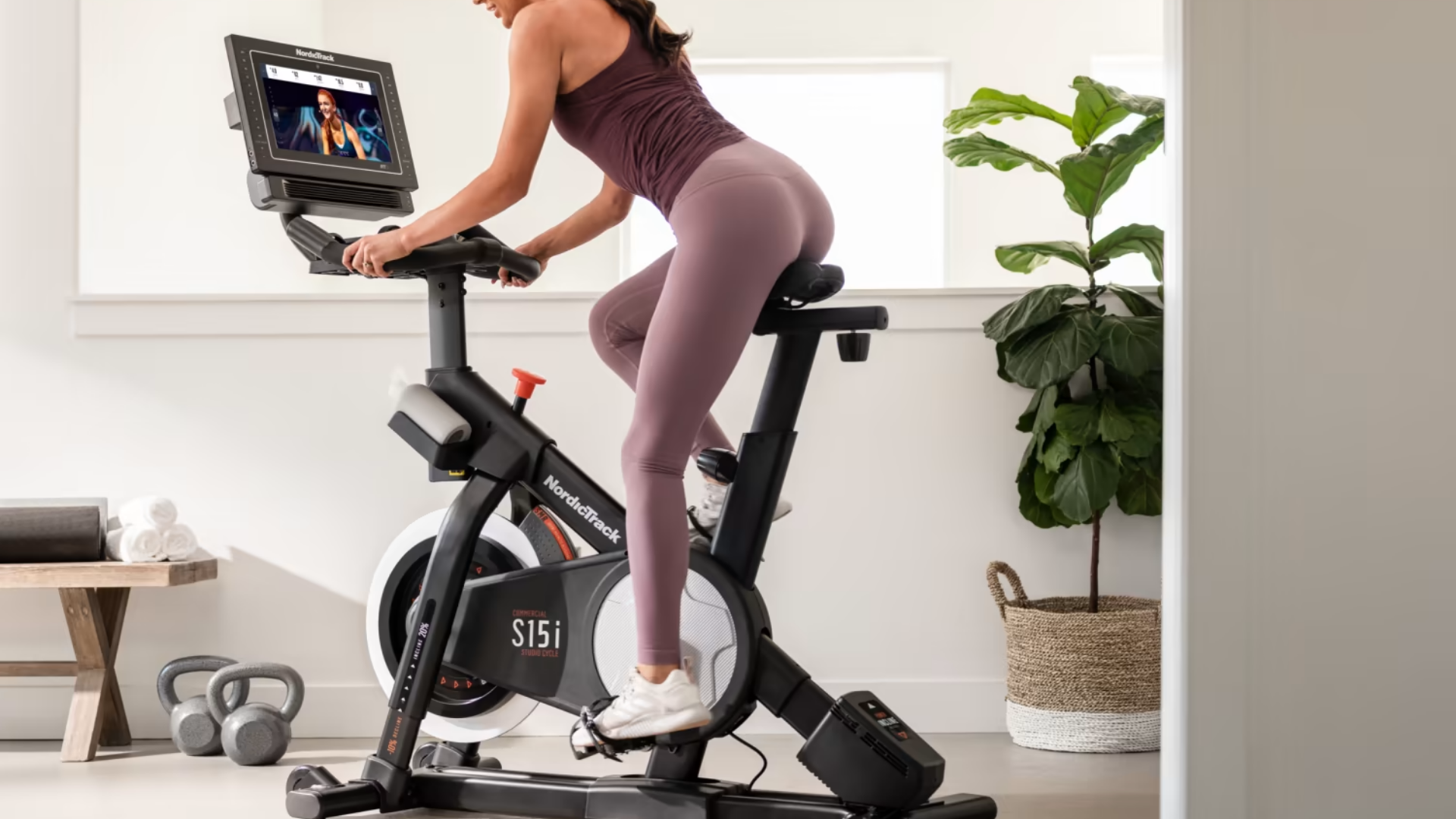 Woman using the Nordictrack S15I New Indoor Cycle