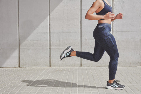 woman running to lose fat