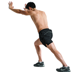 Man doing a standing calf stretch