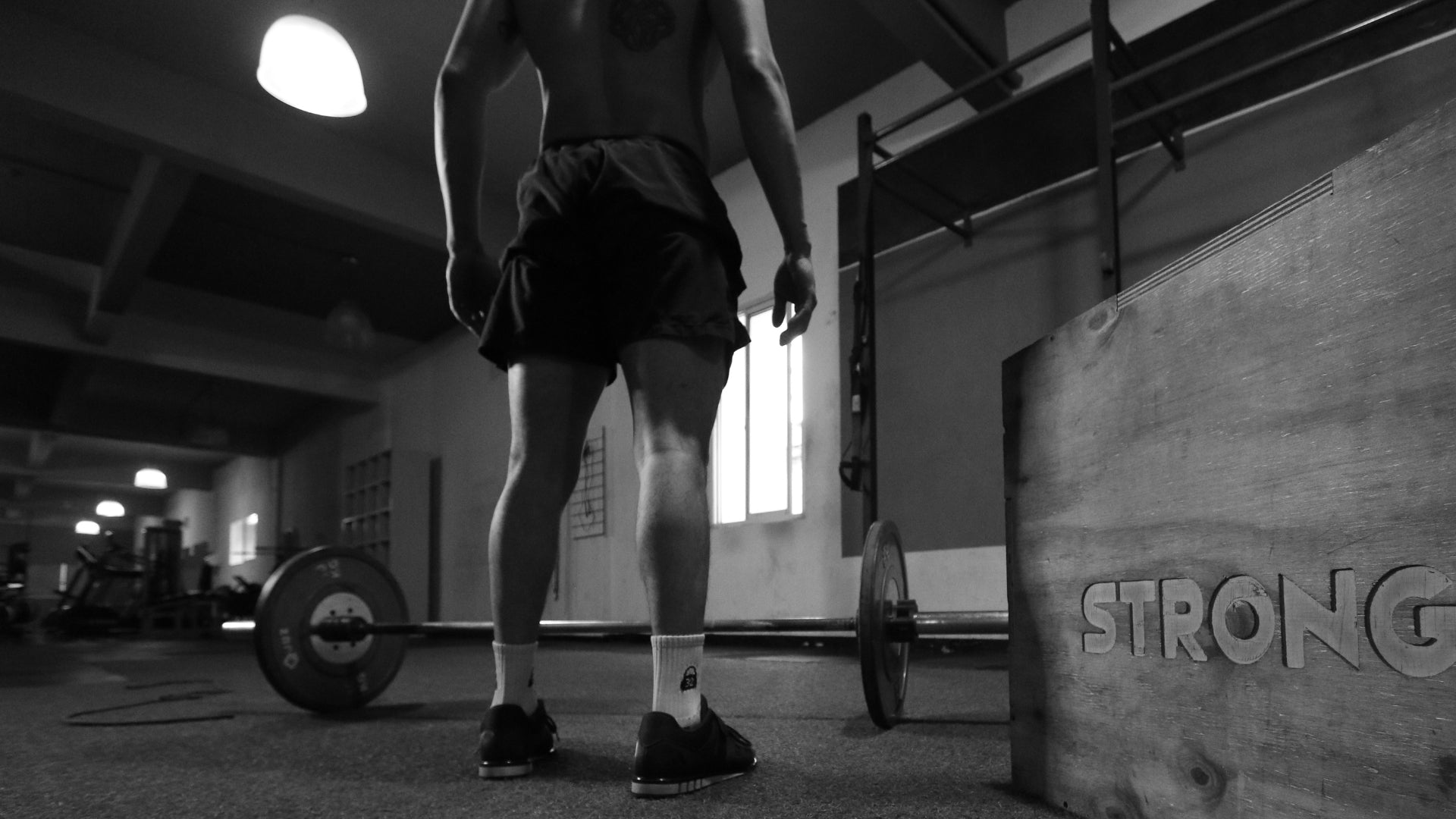 Man in a box for his strength training