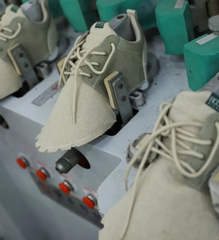 8000 kicks explorer shoes on lasting machine