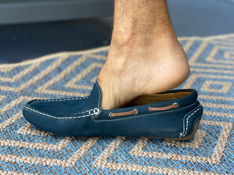 Photo of heel popping out of loafers