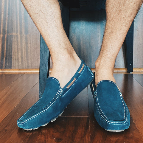 Photo of mens feet wearing loafers with Skinnys inside