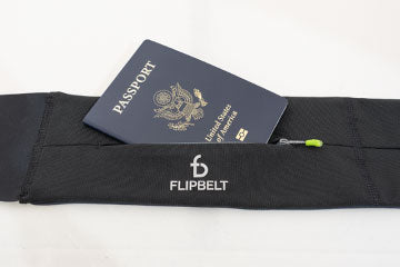 inserting passport into flipbelt zipper pocket