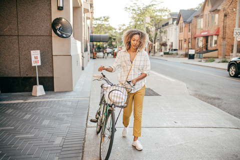 Person biking down sidewalk