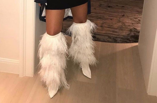 Rihanna in thigh high boots 