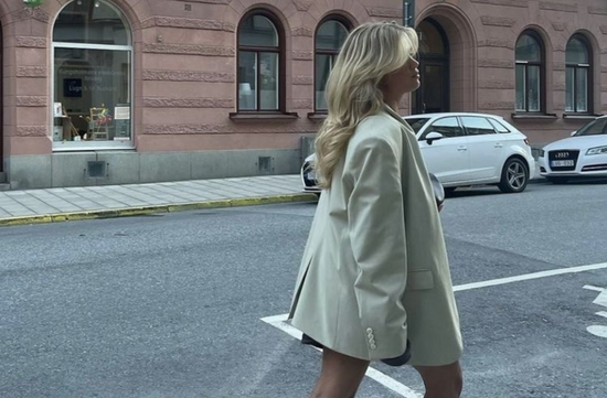 matilda djerf in a cream blazer dress walking down the street 