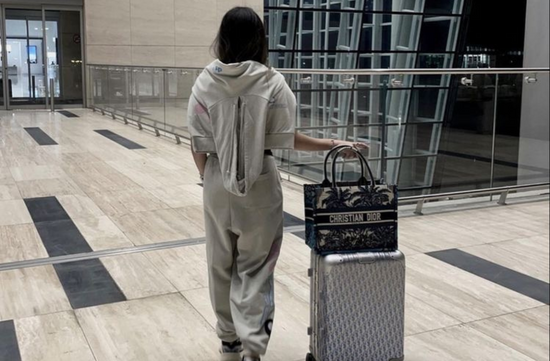 girl in sweats at the airport