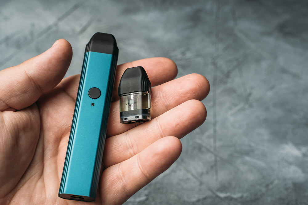 Vaping device and pod