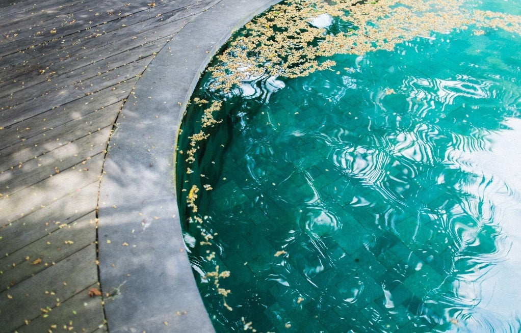 Two little girls swimming in a clean pool