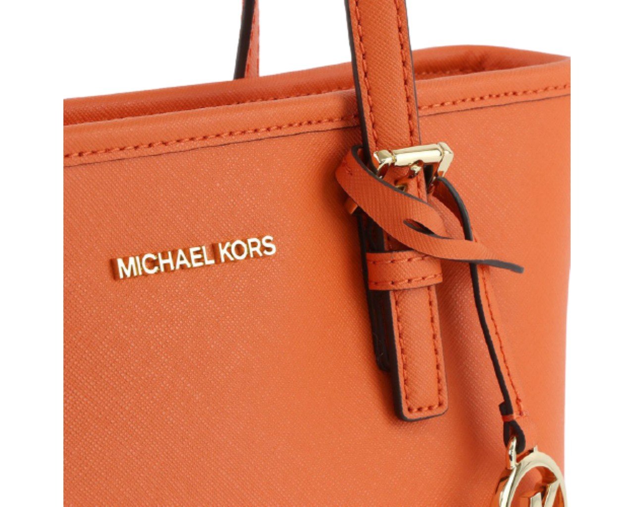 Michael Kors Jet Set Travel X Small Carryall Convertible Top Zip Tote  Made of Saffiano leather; Zip top for closure; 1 inside zip pocket; 1 inside open pocket;  Double leather handles of 12 cm drop; Long adjustable strap of 51-61 cm drop;  Gold hardware; Comes with original tags.     Measurements: Length: 28 x Height: 20 x Width: 13 cm.