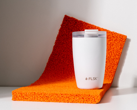 FLSK coffee to go tumbler on orange foam